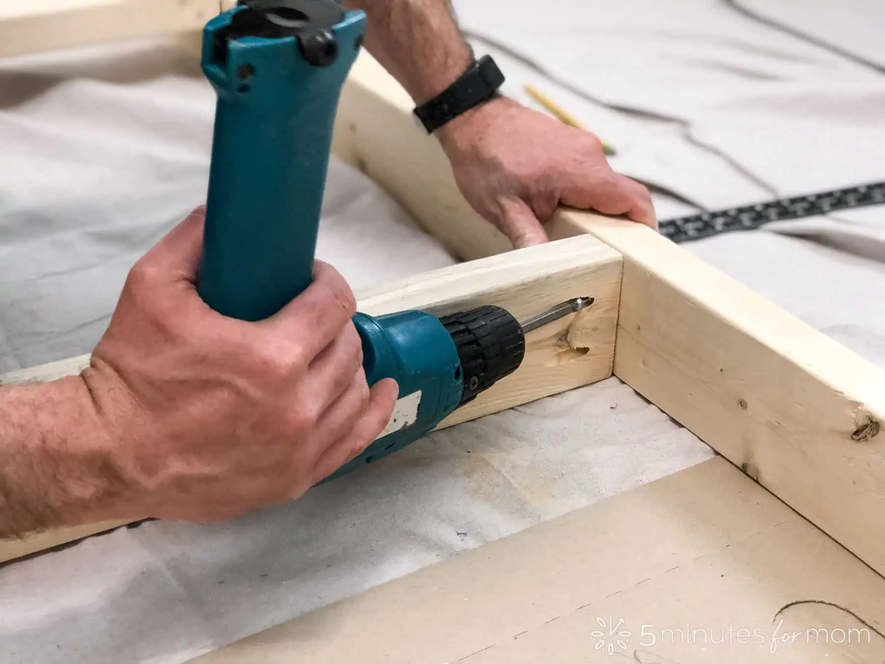 attach center support beams to outer frame of DIY bed frame