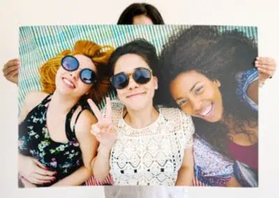 Poster print of three friends smiling together to show a sample of a gift idea of a personalized Mixbook Poster Print