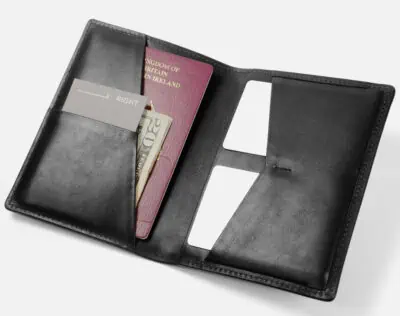 black leather wallet with passport and business cards in it to show a great gift for men being a grams28 passport wallet