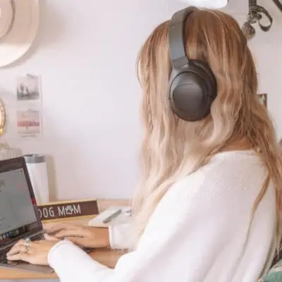 Woman wearing Puro Sound Labs headphones to show a great gift idea for women