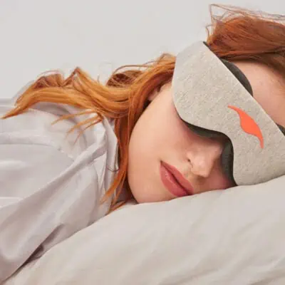 Woman sleeping with a sleep mask - What do women want for Christmas - More Sleep