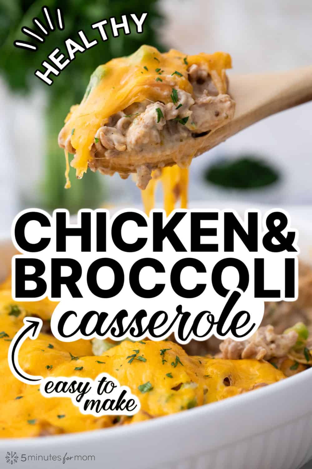 Close up shot of a healthy Chicken and Broccoli Casserole with a wooden spoon serving a spoonful from a casserole dish